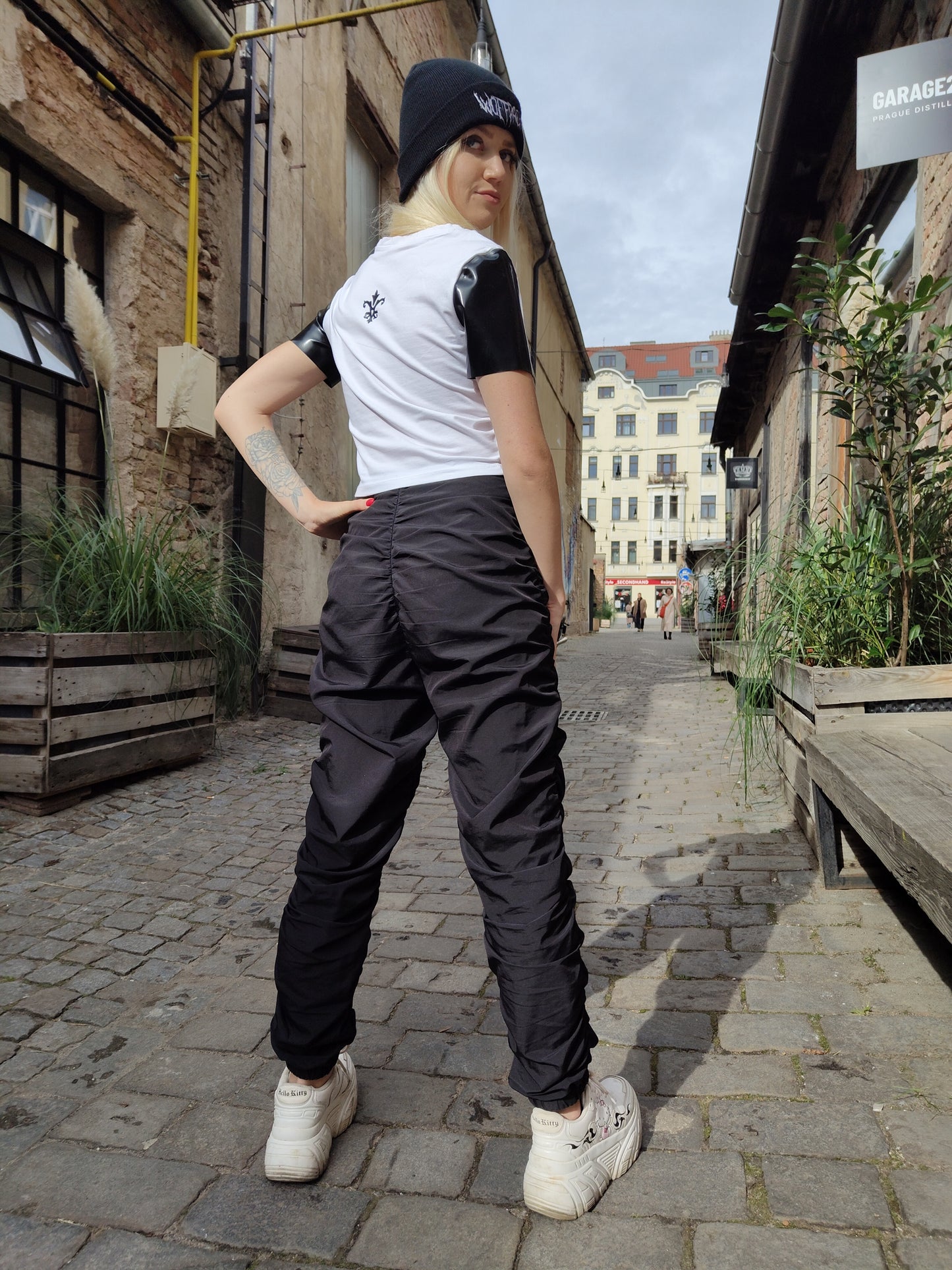 "Where beats drop and latex pops" textile T-shirt with latex short sleeves